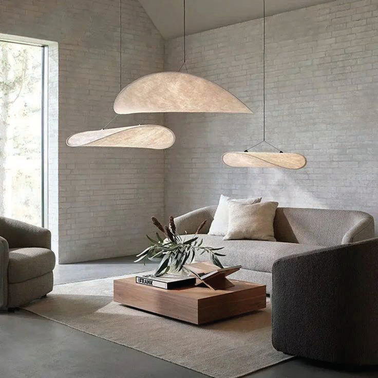 Silk pendants floating over a stone living room