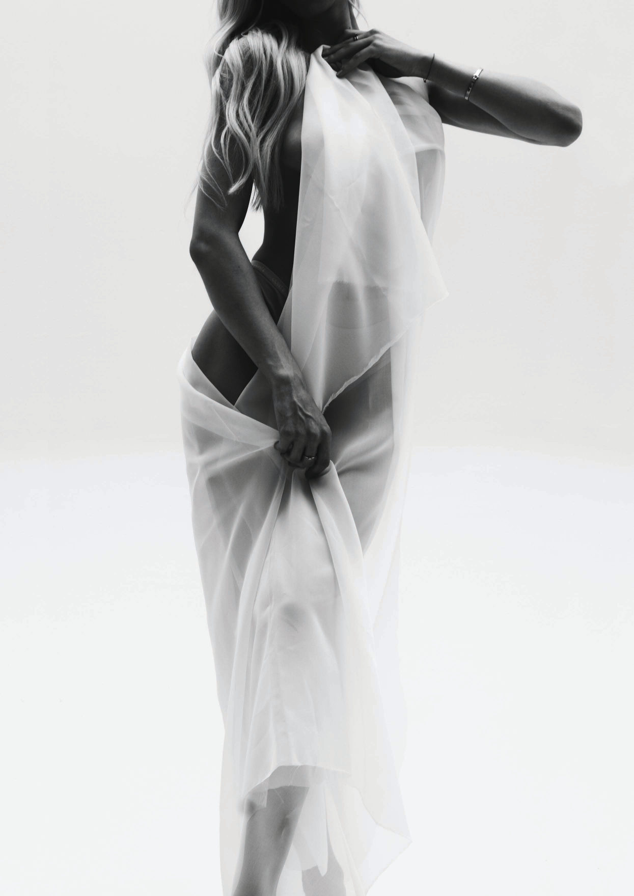 Figure wrapped in white silk