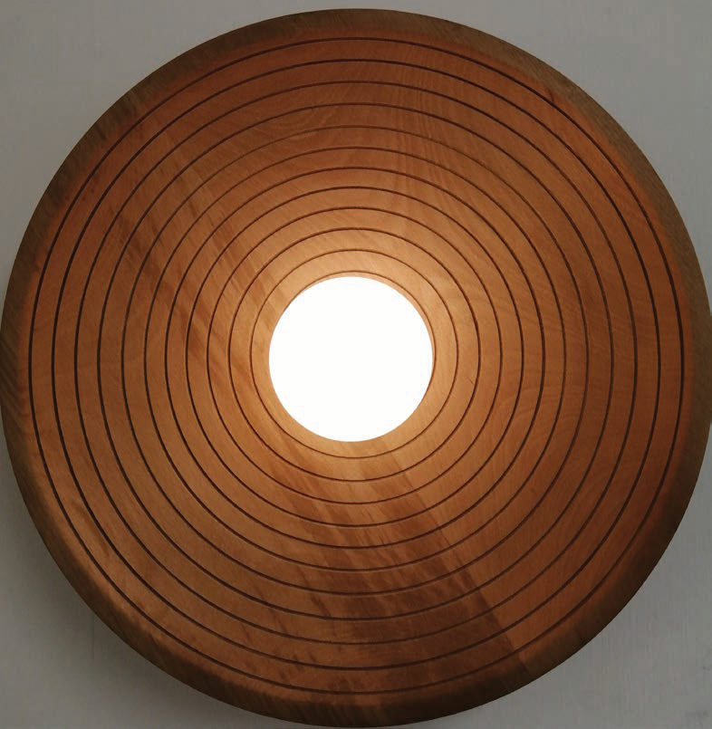 Grooved timber disc wall light