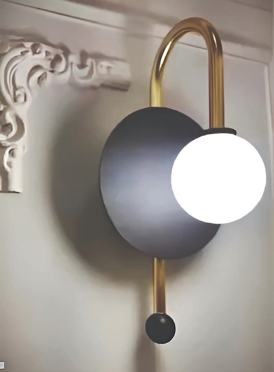 Brass arm wall lamp with opal globe